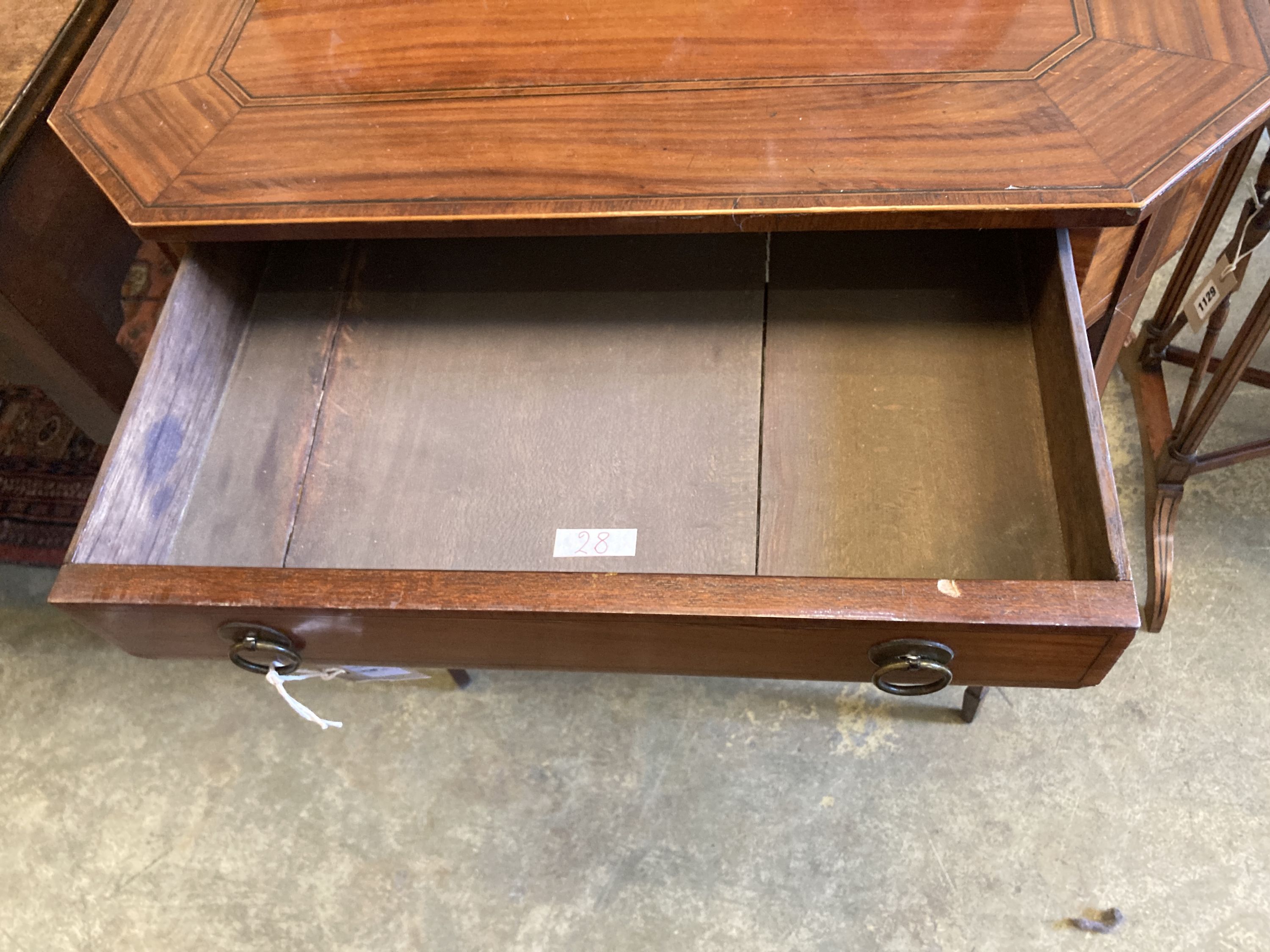 A George III Sheraton style inlaid mahogany side table of canted rectangular form, width 62cm, depth 37cm, height 75cm